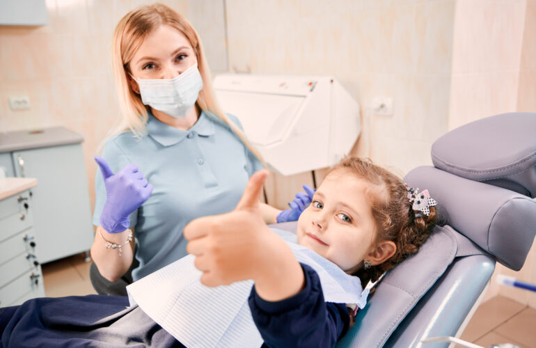 Happy child with a friendly dentist in chicago