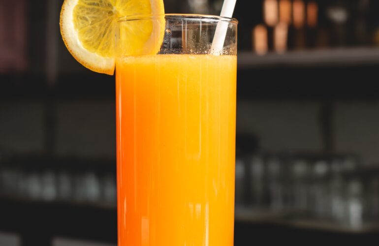 A glass of OJ orange juice tastes bitter after brushing your teeth