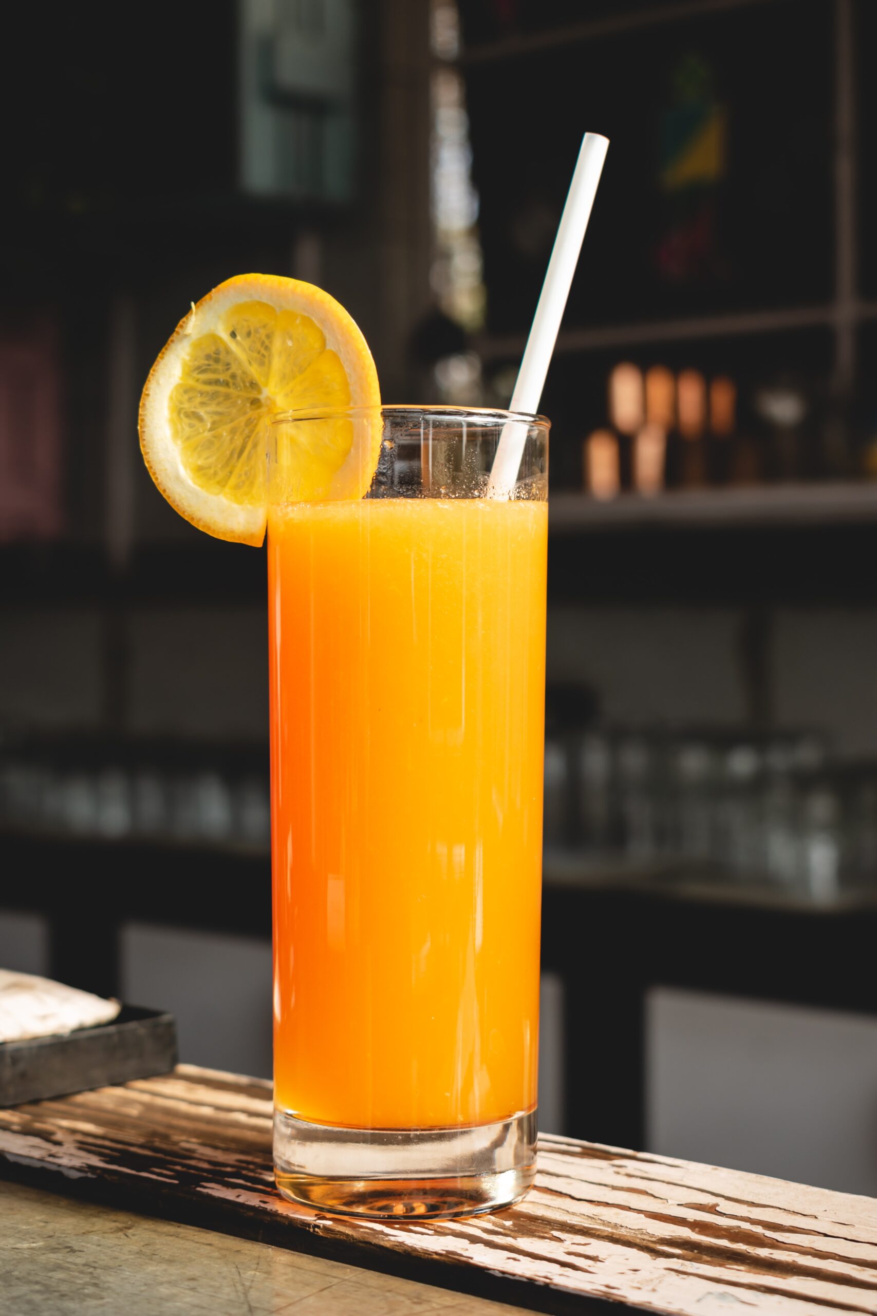 A glass of OJ orange juice tastes bitter after brushing your teeth